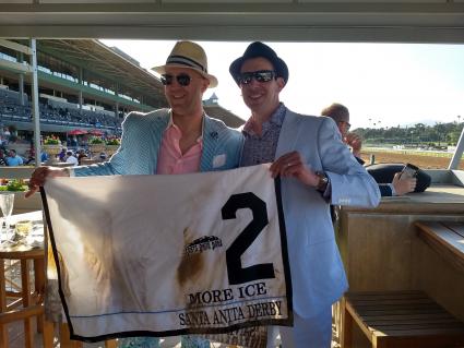 Kenwood Racing co-owners posing with More Ice's saddle cloth from the Santa Anita Derby on April 6, 2019