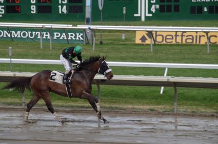 Mandel, with Jose Ferrer in the irons, wins by 14 lengths in race 8 at Monmouth Park on July 15, 2018